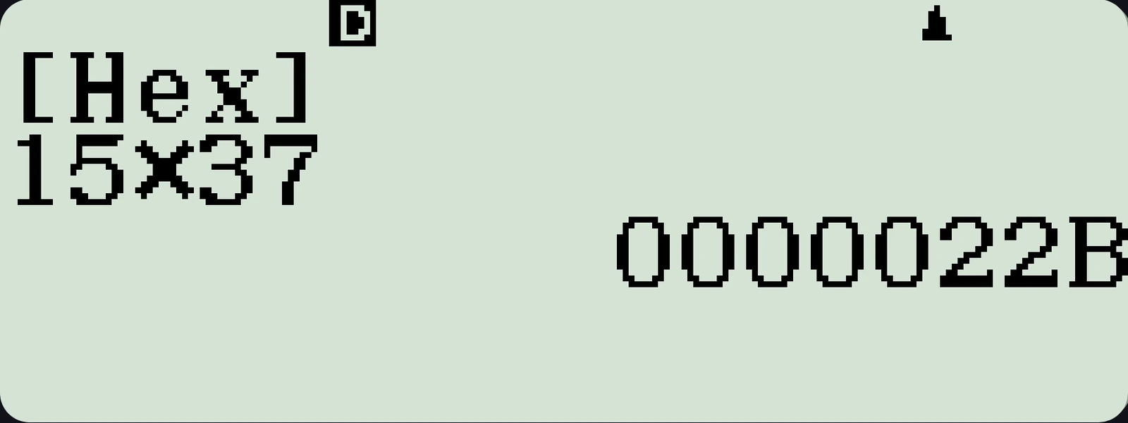 The emulator's Base-N mode LCD, showing 15 times 37 computed in decimal as 555 and converted to hexadecimal as 0000022B.